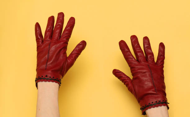 Red leather gloves stock photo