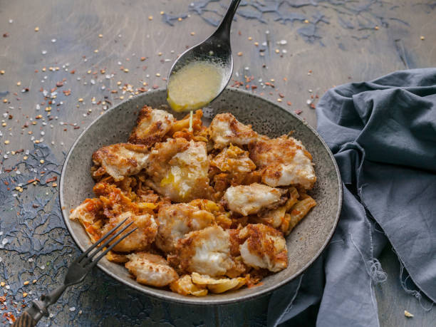 istock Codfish with vegetables and tomatoes with honey-lime sauce. Healthy seafood. Ketogenic diet. Close-up 1188988945