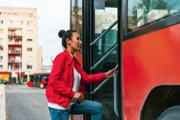 istock Woman entering the public tram 1188989975