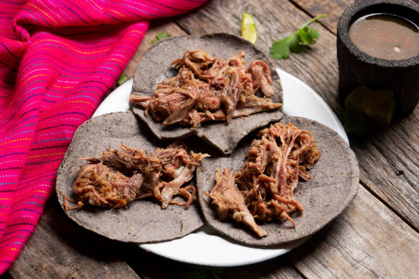 istock Mexican slow cooked lamb tacos also called barbacoa on wooden background 1188989994