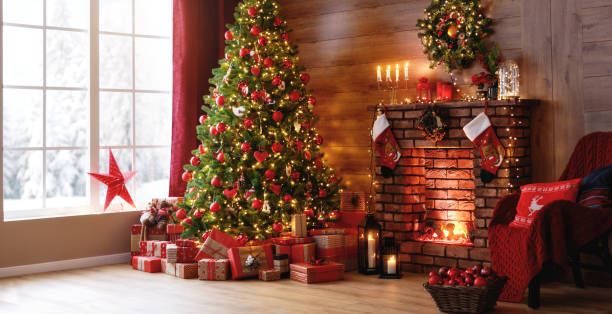 istock interior christmas. magic glowing tree, fireplace, gifts 1188990438