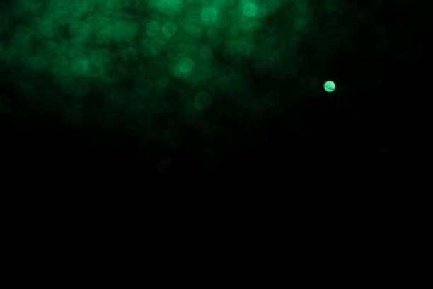 istock Abstract Blurred image background green bokeh with black background. 1188992169