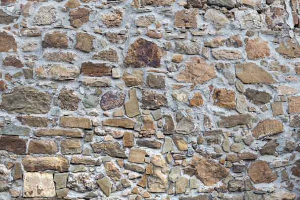 istock Stone wall of rough unprocessed stones 1188993708