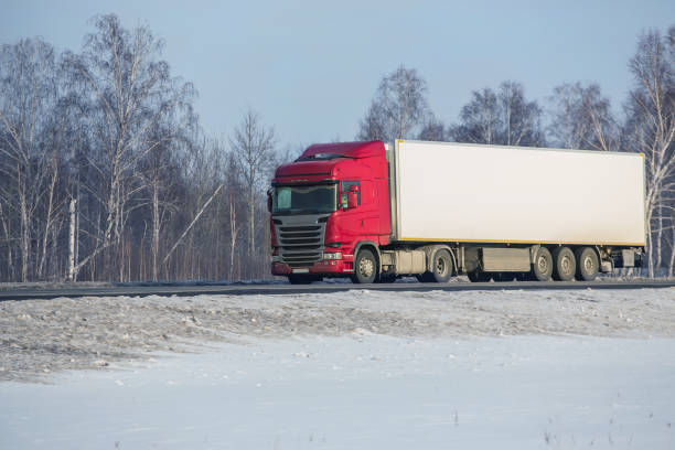 istock truck goes on winter highway 1188993787