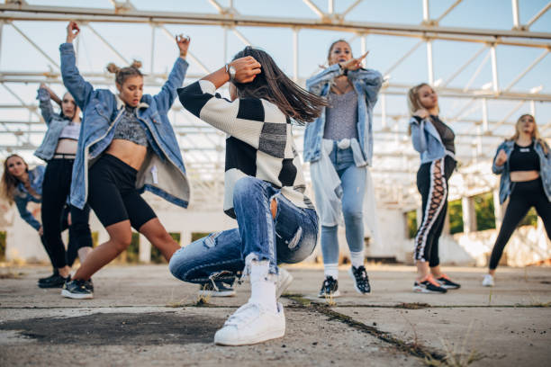 istock Group of young female dancers 1188996577