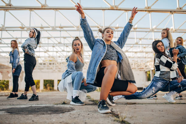 Young female dancers Group of young female dancers outdoors dance troupe stock pictures, royalty-free photos & images