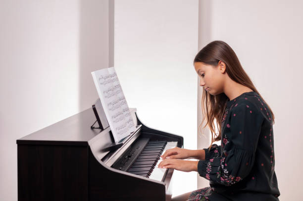 istock Girl learning piano, she is sad, 1188998208