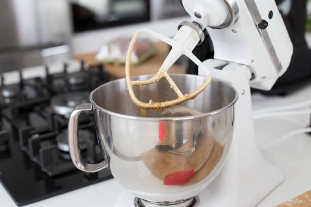 istock White electric mixer preparing a cake batter in a kitchen 1189001773