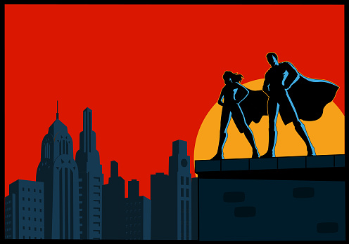 A silhouette style vector illustration of a couple of superheroes standing on top of a rooftop with city skyline in the background. Wide space available for your copy.