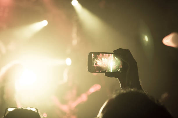 istock Filming concert on smart phone 1189002638