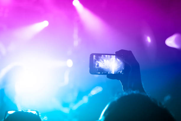 istock Filming concert on smart phone 1189002640