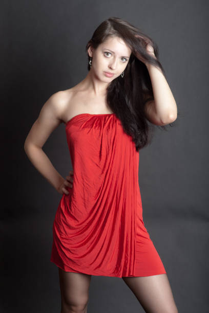 istock girl in a red dress 1189003292