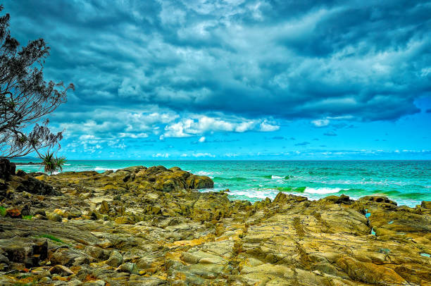 King Beach Caloundra Rocks on Caloundra beach on Queensland's Sunshine Coast caloundra stock pictures, royalty-free photos & images