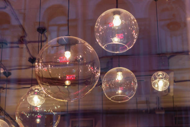 transparent round lampshades with incandescent bulbs. design interior illumination home
