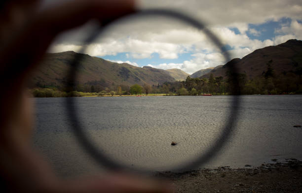 Landscape through a lens with lake mountain background