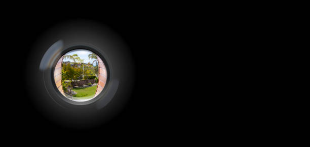istock View through peephole in door looking out to entry 1189009399