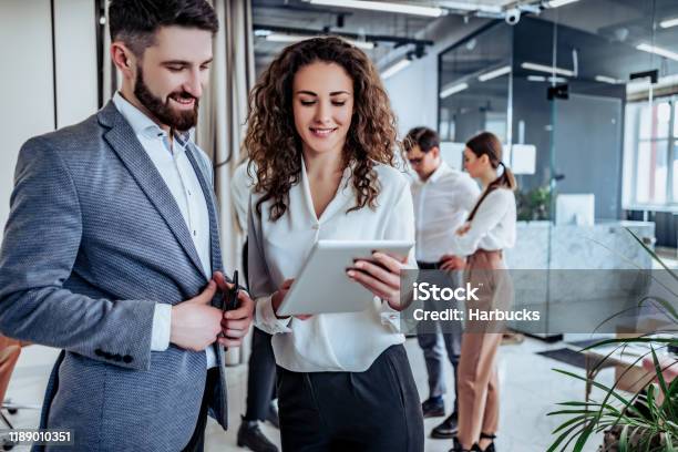 Business People Having Fun And Chatting At Workplace Office Stock Photo - Download Image Now