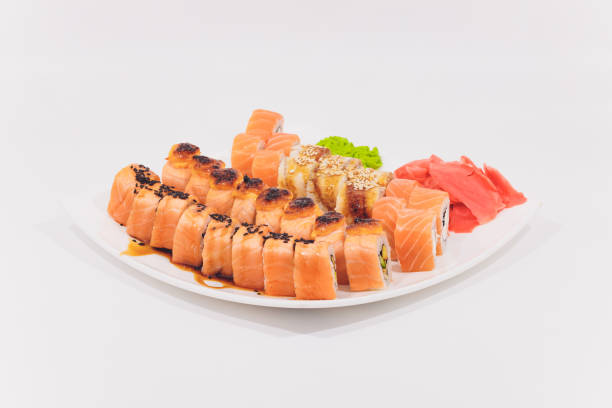 istock Snow crab, salmon, cream cheese and cucumber rolls isolated on white background. 1189010784