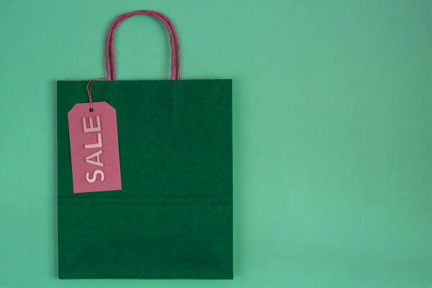 istock green paper craft bag with sale tag 1189012335