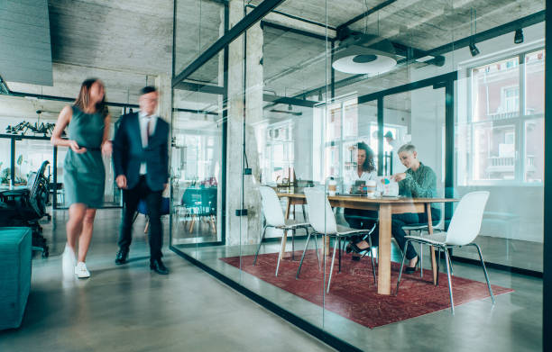 istock Business meeting at busy corporate office. 1189012400