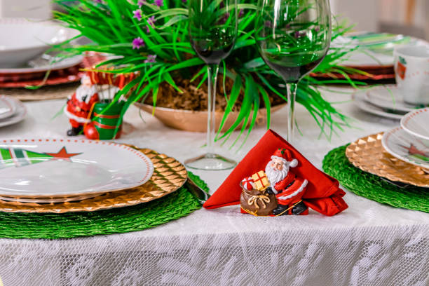 istock Table served for Christmas dinner with decorations in living room, close up view 1189016327
