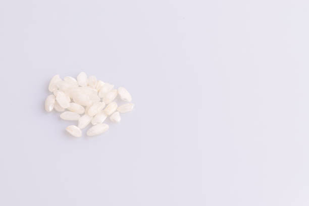 Italian Risotto rice on white background. Copy Space. Soft light. Latin term \