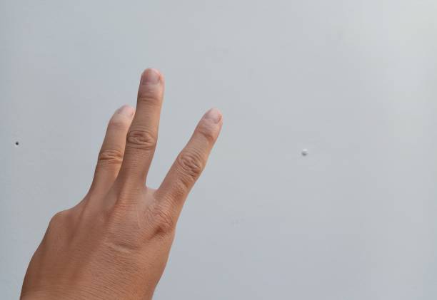 istock A man raising his hand with 3 fingers 1189017921