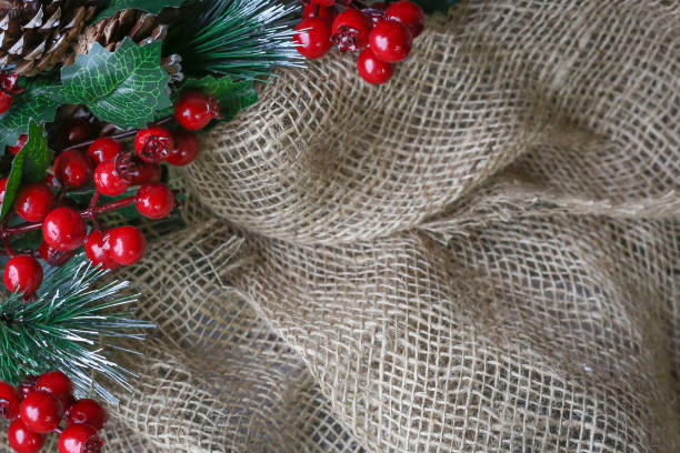 istock background image of rough burlap framed with ornamental cranberries 1189020828