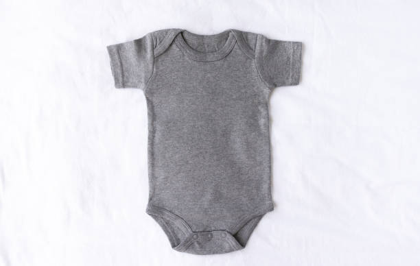 Gray Christmas baby onesie bodysuit mock up with on a white cotton background blank mockup for own design babygro stock pictures, royalty-free photos & images