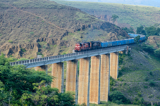 Freight train crossing a viaduct at Shindawane near Pune India.