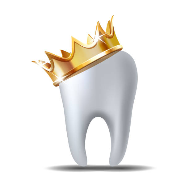 istock Realistic white Tooth in golden crown isolated on white 1189034220