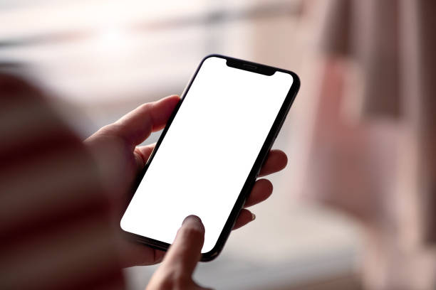 istock Woman touching on screen and holding blank screen mock up mobile phone 1189034494
