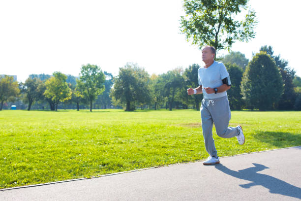 istock Active senior man running in park 1189050150