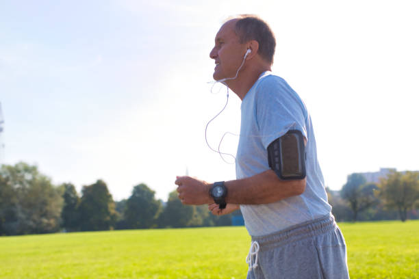 istock Active senior man running in park 1189050269