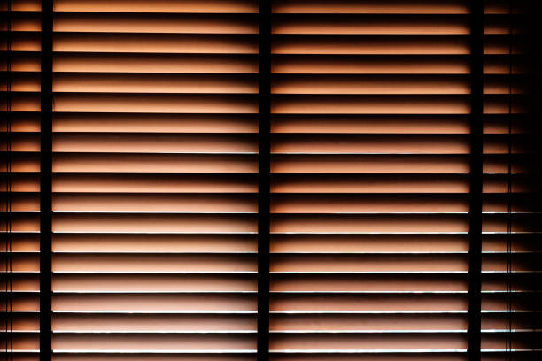 Beautiful close-up wooden brown bamboo curtain pattern with passing through sunlight