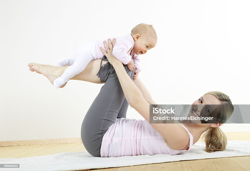mother and baby exercise Baby - Human Age Stock Photo