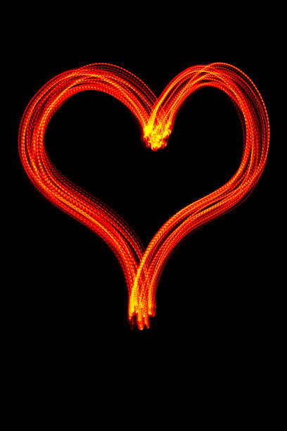istock Glowing heart - LED light painting (red) 1189062129
