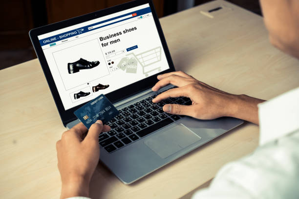istock Young man use credit card for online shopping 1189062780