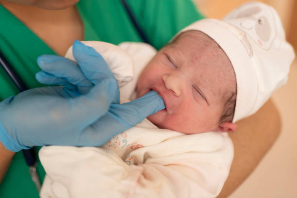 istock New born baby and doctor 1189065177