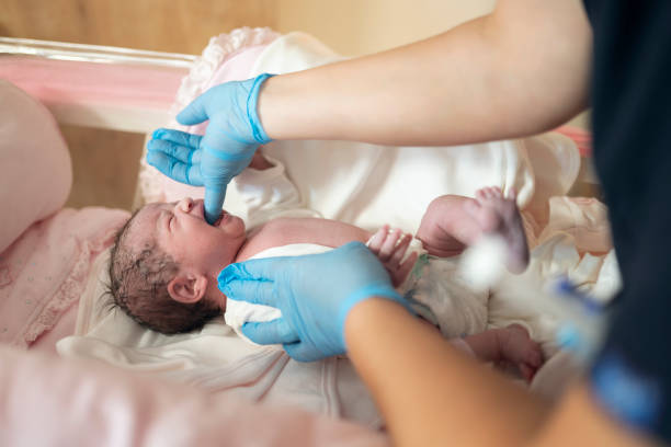 istock New born baby and doctor 1189065178