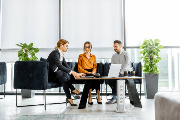 Young couple with financial advisor at the office