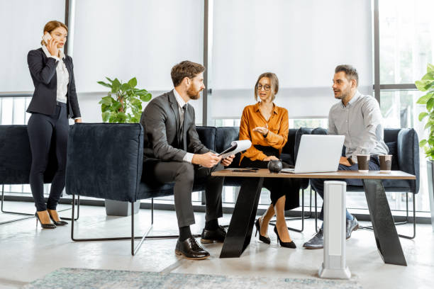 istock Young couple with financial advisor at the office 1189065433