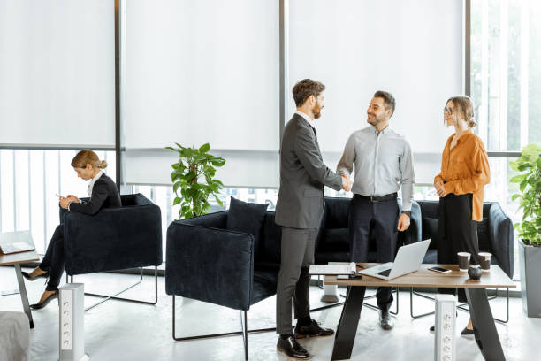 Young couple with financial advisor or agent at the office