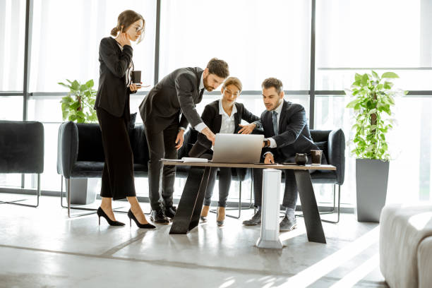 istock White-collar bank employees meeting in the office 1189065607