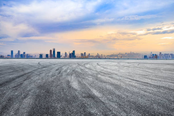 istock Sunset empty asphalt road and city skyline in Chongqing 1189066236