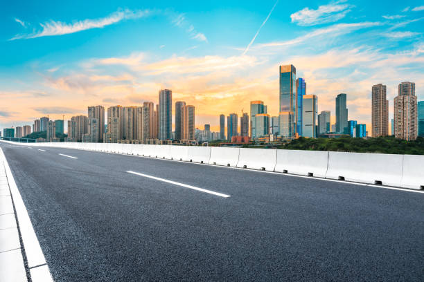 istock Sunset empty asphalt road and city skyline in Chongqing 1189066532