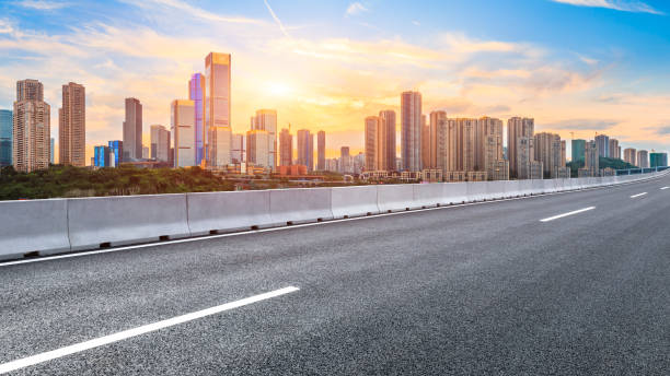 istock Sunset empty asphalt road and city skyline in Chongqing 1189066832