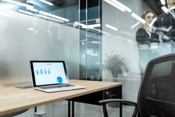 istock Working place with laptop and chart 1189066927