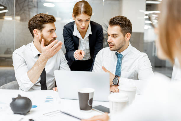 istock Team leader with employees in the office 1189067768