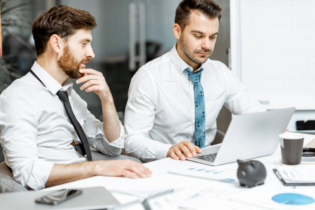 istock Exhausted employees working in the office 1189067817